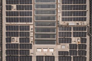 Rooftop solar panels catching sunlight on a residential home